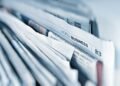 Newspapers laid out for reading