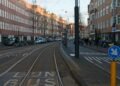 Tram line crossing a sunlit European city street