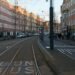 Tram line crossing a sunlit European city street